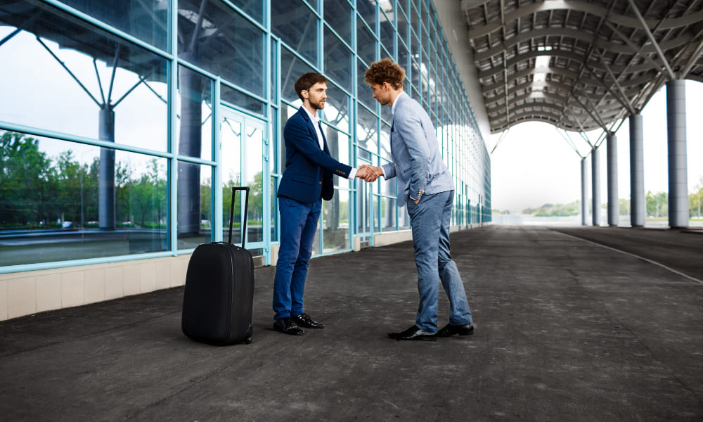 picture-two-young-businessmen-meeting-shaking-hands